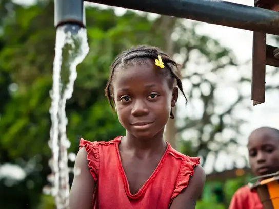 Girl in red dress looking at camera