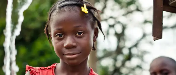 Girl in red dress looking at camera
